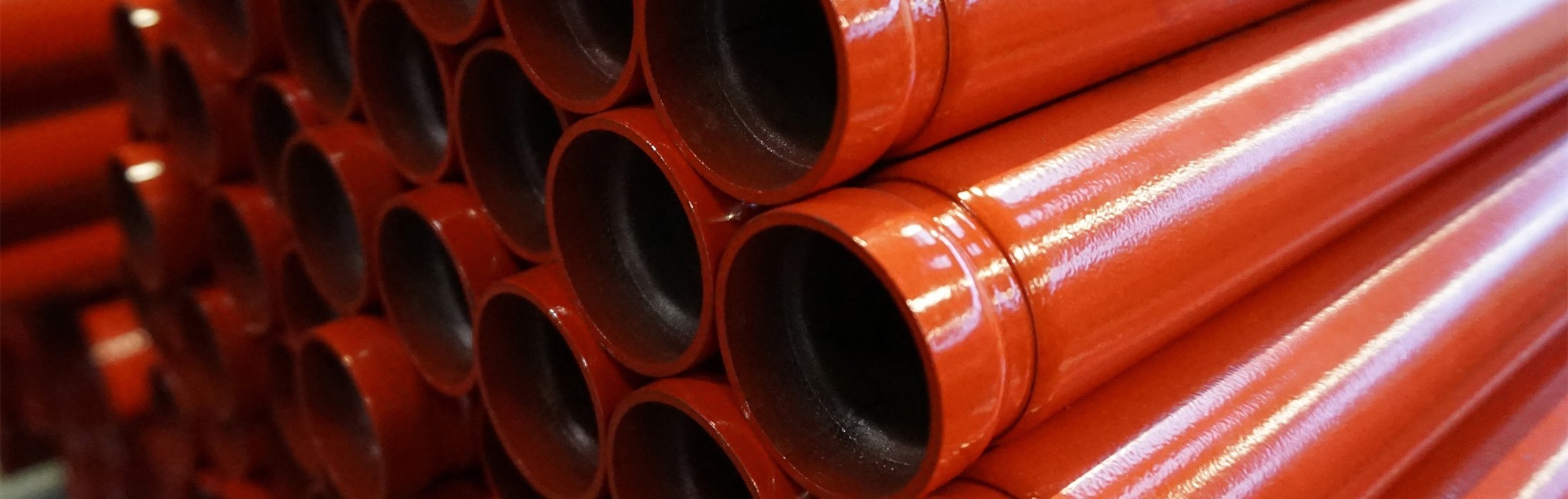 Red coated sprinkler tubes with a ril